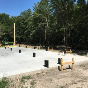 Shop 1 Timber frame U brackets installed in a concrete slab foundation for a 40x60 gambrel barn