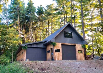 Gable barn with garage doors and windows