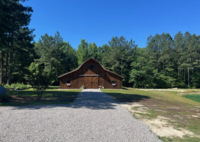 Kissell 46x50 gambrel barn finished and decorated with beautiful gravel drive