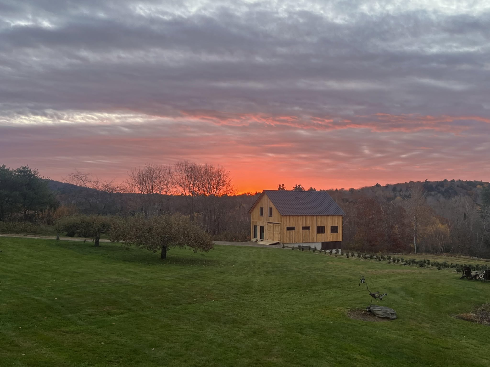 Timber frame barn at Winterport Evergreen Farm at sunrise